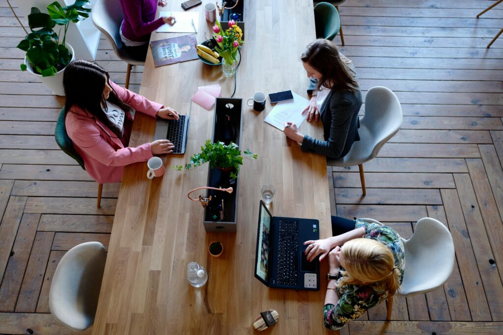 People on their computers at a desk