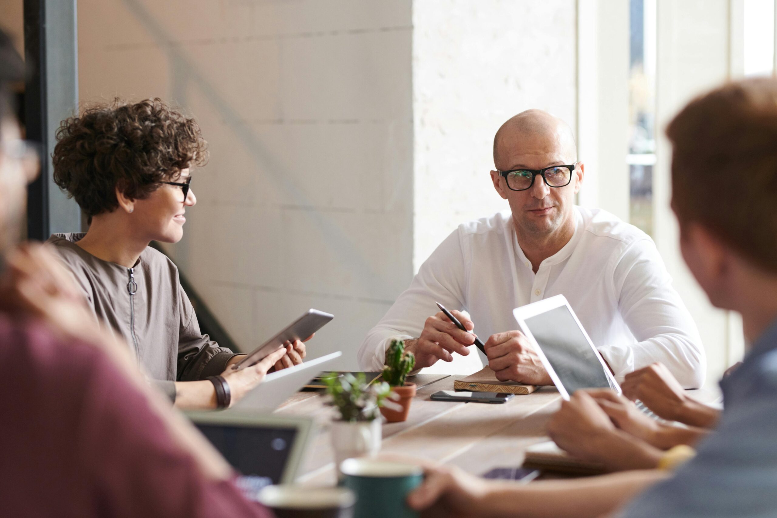 Man and woman sitting around table planning