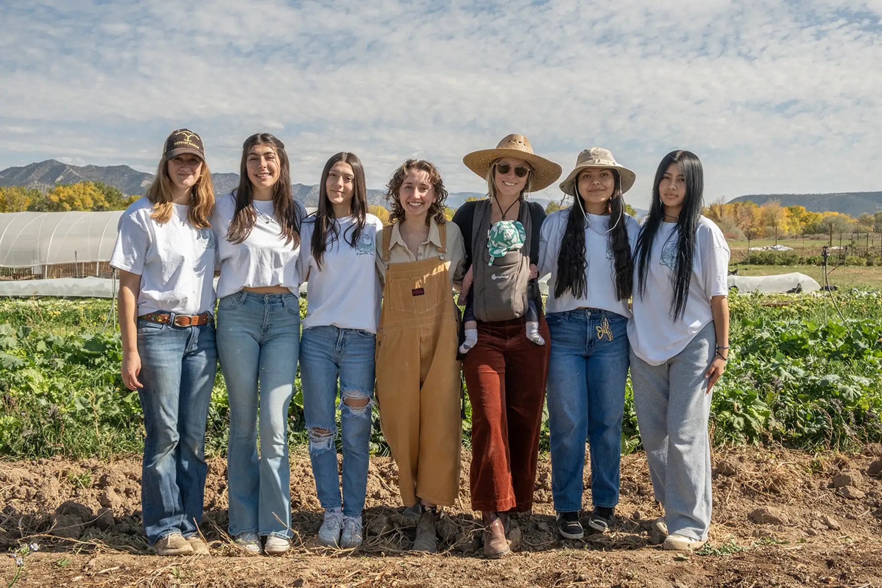 A group of young women in a crop field