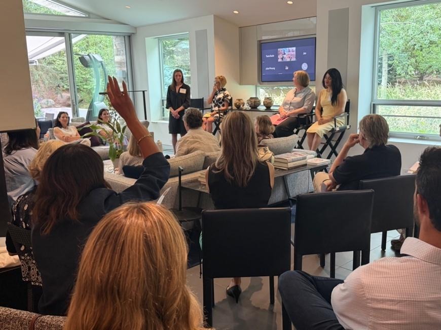 The Giving Network meeting in a large meeting room